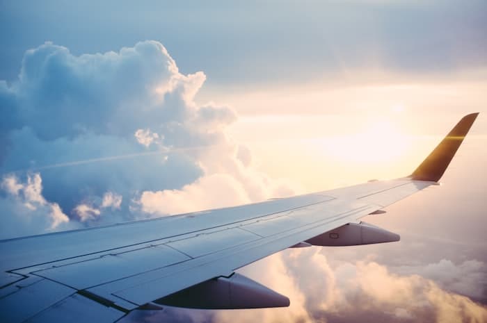 Airplane wing with clouds